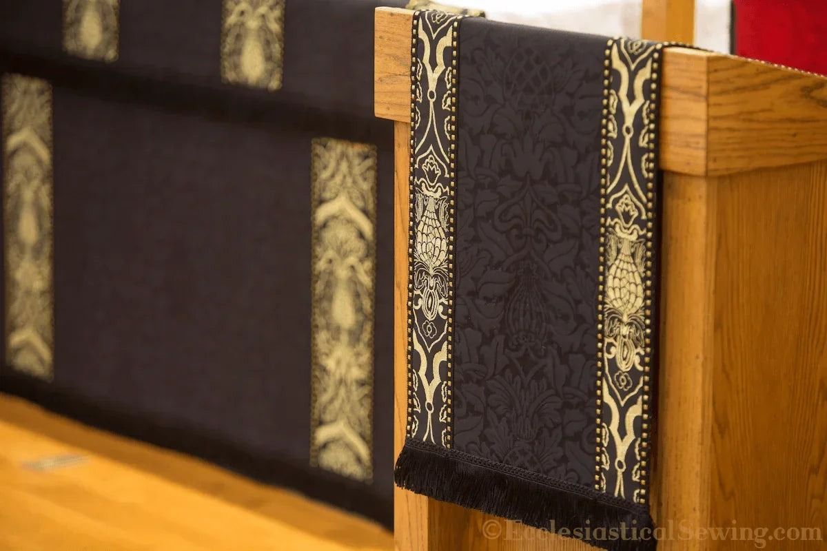 The Saint Justin Martyr lectern fall in black and gold, on a lectern