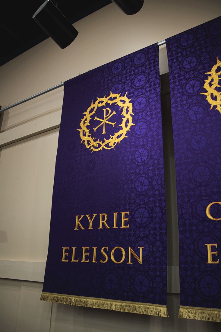 Violet Kyrie Eleison and Christe Eleison banners with a gold Chi Rho in a crown of thorns