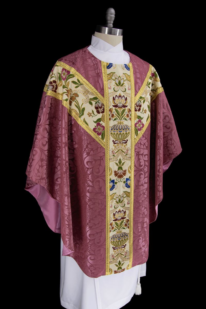 The rose Florence chasuble with tapestry orphreys on a dress form