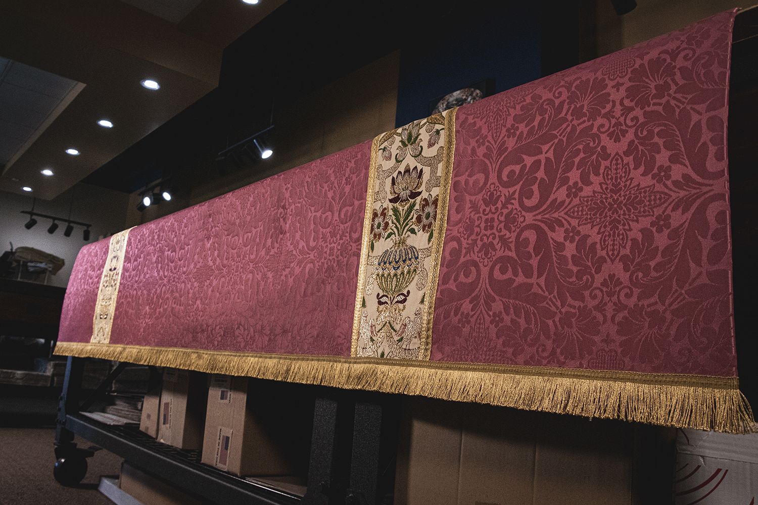The rose Florence superfrontal with a tapestry panel, on an altar in our workroom