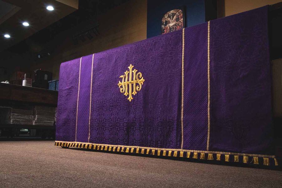 A violet frontal with a gold IHS
