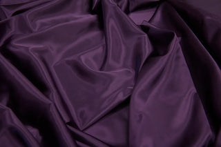 Eminence Satin fabric smooth finish close up. Polyester Satin Bridal Fabric. Used for church vestment lining. 