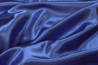 Eminence Satin fabric smooth finish close up. Polyester Satin Bridal Fabric. Used for church vestment lining. 