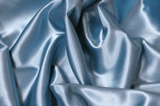 Eminence Satin fabric smooth finish close up. Polyester Satin Bridal Fabric. Used for church vestment lining. 