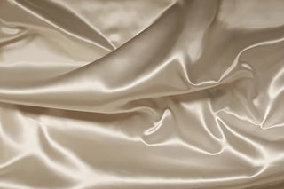 Ivory Polyester satin fabric for bridal and flower girl dresses, evening wear, formal wear, church vestments. 