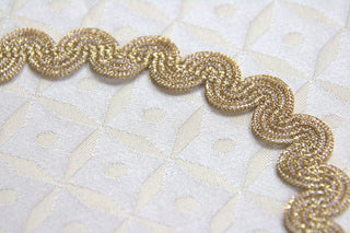 
1/2 inch metallic gold flexible gimp braid trim for curved edges and decorative sewing