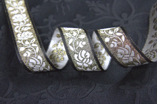 Black Gold and White Rose Jacquard Trim displayed on Black ecclesiastical brocade fabric
