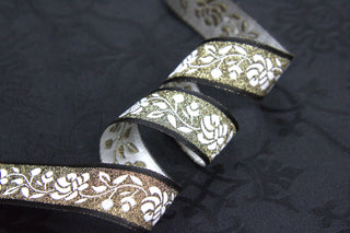 Black Gold and White Rose Jacquard Trim displayed on ecclesiastical brocade fabric