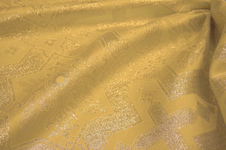 Draped Tintern Brocade showing metallic thread and geometric church textile pattern