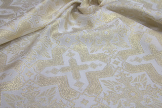 White and gold ecclesiastical brocade with eight-pointed stars, crosses, eagles and palmette motifs