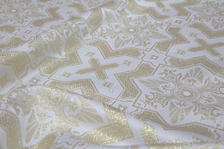 White and gold Tintern liturgical brocade with crosses and eight-pointed stars in a geometric diaper pattern