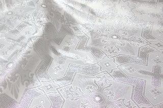 White and silver Tintern Brocade with geometric crosses and eight-pointed star motifs
