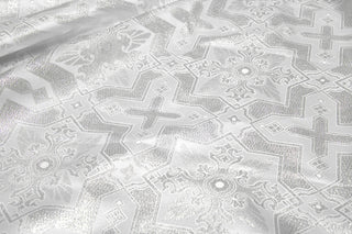 White and silver Tintern Brocade with geometric crosses and eight-pointed star motifs
