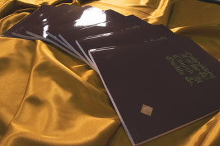 Embroidery for Church Guilds: Copies fanned across gold satin.