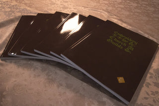 Embroidery for Church Guilds: Fanned burgundy covers on pale damask.