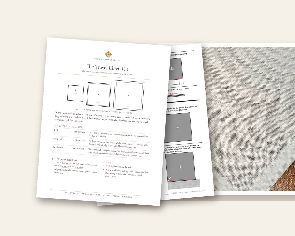 The Travel Linen Kit pattern cover and an illustrated instruction page lying on a hemmed Irish linen purificator
