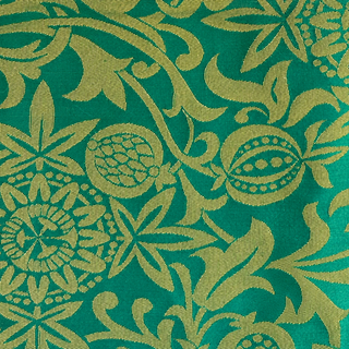 Passion Flower brocade in Green and Gold with repeating woven flowers and scrolling foliage.