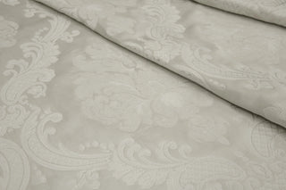 Chenille floral weaving on the satin ground of Ravenna Ivory Brocade for light uholstry