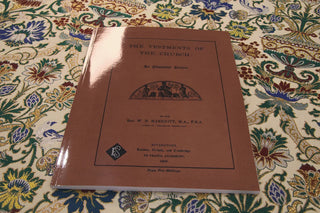 The Vestments of the Church by W. B. Marriott: Brown cover on floral tapestry fabric.