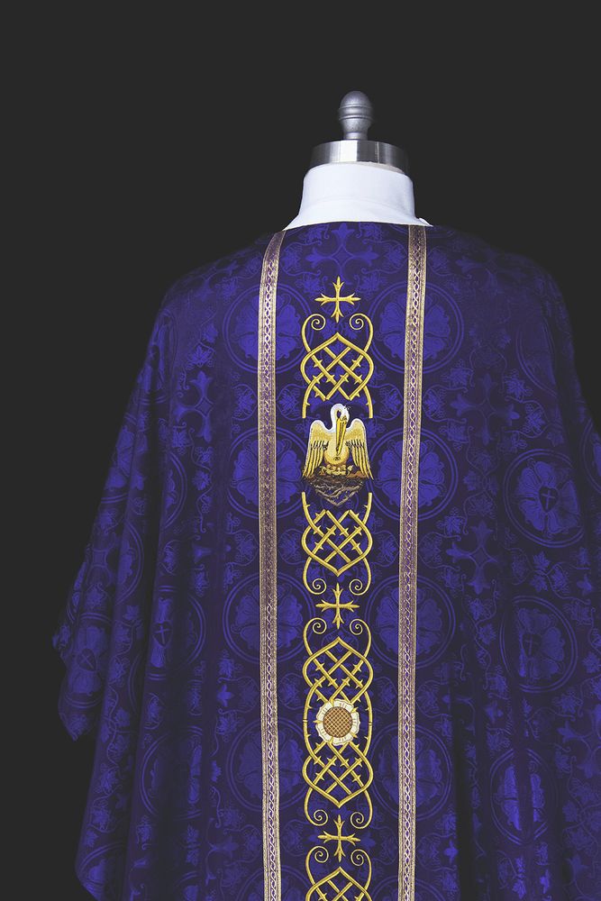 The back of a violet chasuble with a pelican on a gold orphrey