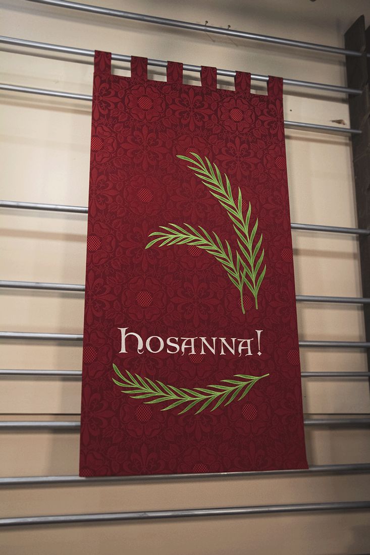 A red Palm Sunday banner: Hosanna! between palm branches