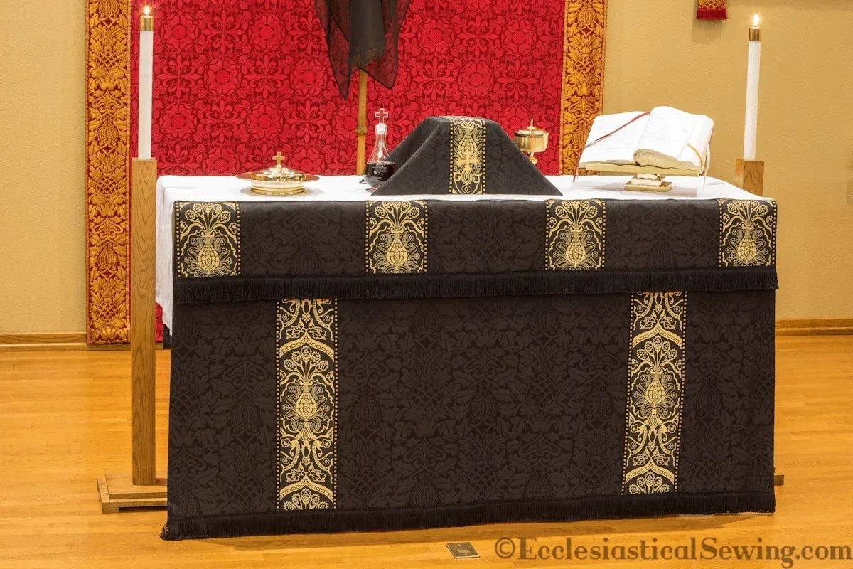 The Saint Justin Martyr frontal and superfrontal in black and gold brocade on an altar