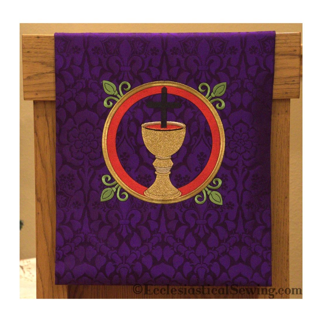 The Gethsemane pulpit fall on a lectern: a chalice and cross in a red ring
