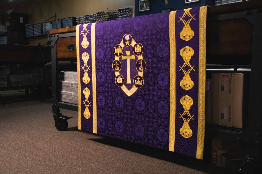 A violet hanging with a cross in a medallion between gold orphreys